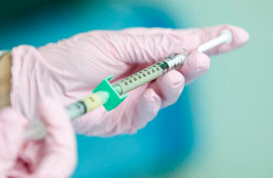 A syringe holding vaccine.