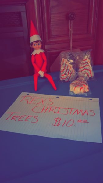 This elf was selling Christmas trees. Photo by Kaitlyn Wakeford.