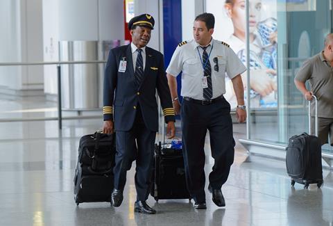Pilots walking through an airport. Photo credit: Sorbis/Shutterstock