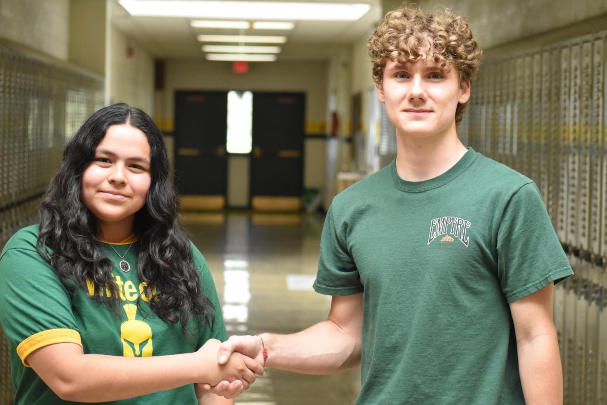 The author, Rosa Cruz, shaking hands with Jacob Schmikale. Photo credit: Antonio Junceda