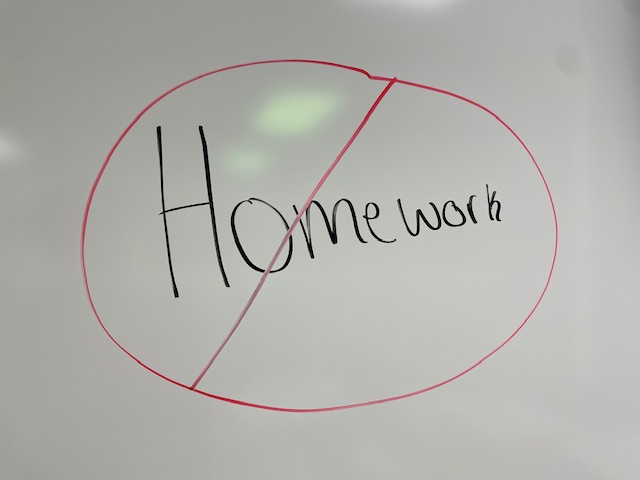 A no-homework sign on a whiteboard.
Photo credit: India Woods.