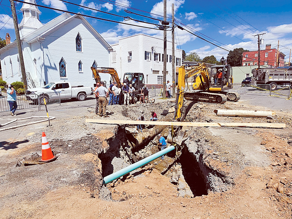 Repairs to the sinkhole involved city and public service district employees as well as the Lewisburg Volunteer Fire Department. Photo credit: The Mountain Messenger.