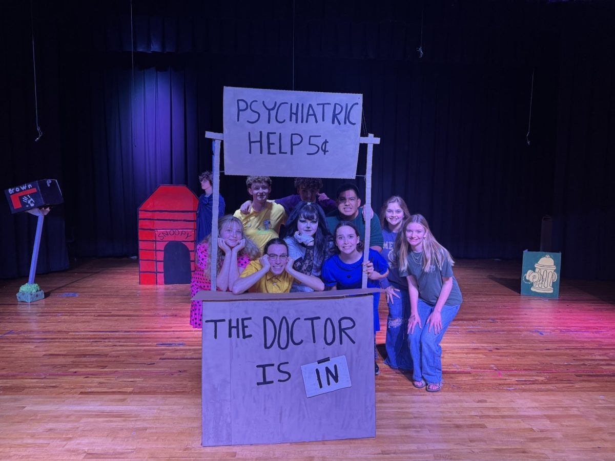 Group photo of the cast members and several musicians of the Charlie Brown musical. Photo credit: Jeremiah Torres